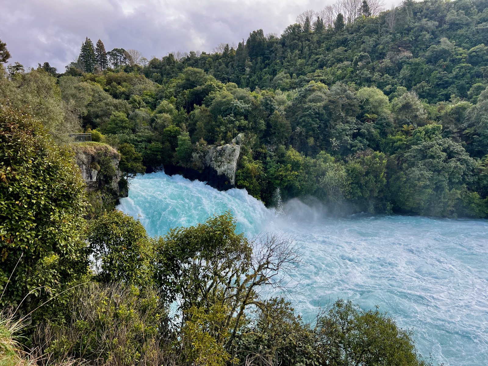 Huka Falls thundering ice-blue and white into its pool