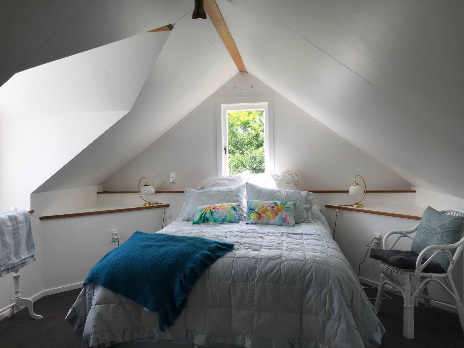 The upstairs guest room under the villa's gables